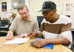 Eugene (right) works with Learning Program Director, Jason, on Vocational Discovery